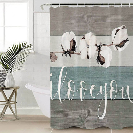 Dusjforheng med bomullsblomster og tekst